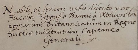 Black and white photograph. A passage of handwritten text with black ink on a rectangular format sheet of white paper, in a curling, cursive style. 