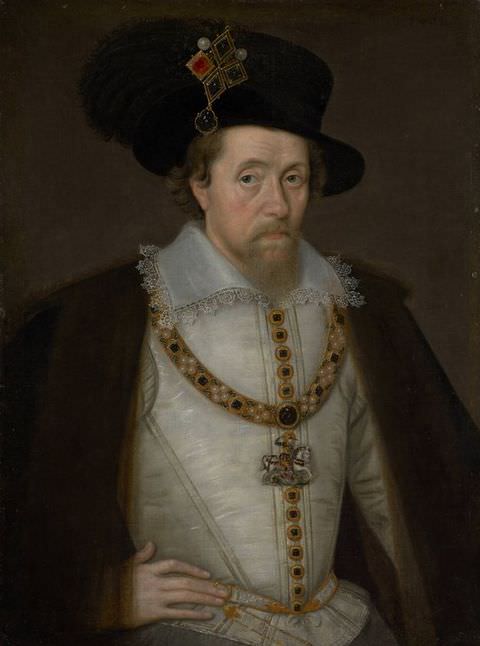 Painting. A colour portrait of a man seen from head to waist, facing towards us with a serious expression. He is wearing a silver, fitted jacket, a brown cape, and a large black hat adorned with a colourful brooch.