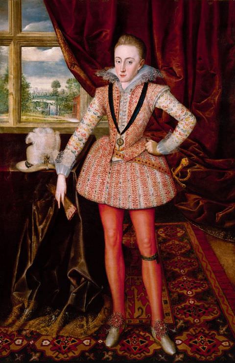 Painting. A young man dressed in richly patterned, historical clothing including a corset, a short skirt, and red tights, stands within a daylit interior featuring indulgent fabrics and a detailed rug. In the distance, a curtain sweeps back to reveal the green landscape beyond.
