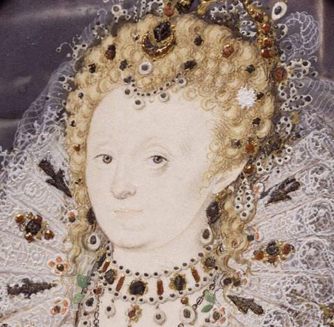 Painting. A close-up portrait of a woman’s head against a pale purple background. She has pale skin and blonde hair, which is pulled up into an elaborate hairstyle, and wears a stiff, intricate lave collar. A richly jewelled necklace is high on her neck, and her hair and collar are scattered with further jewels.