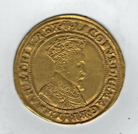 Colour photograph. A gold coin is photographed against a white background. Text encircles the circumference of the coin, and within this is a portrait of a man in profile view, wearing a crown and richly adorned clothing.