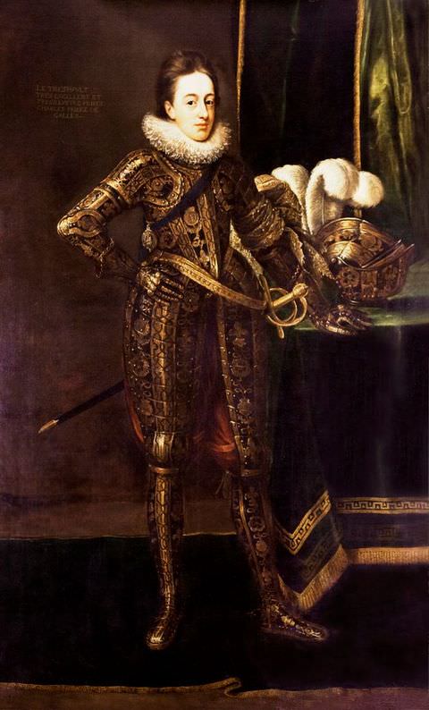 Painting. A full-length portrait of a young man dressed in an elaborate historical costume resembling armour, bedecked with a detailed, gold pattern, and a stiff, white collar. The dark purple background behind him features a draped fabric in green and black, while a gold helmet featuring a large feather is placed on a table to the right of the image.